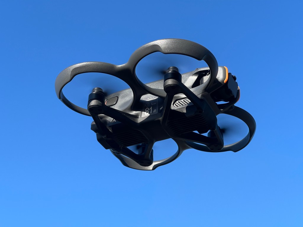 A FPV drone hovering in the air whilst filming.